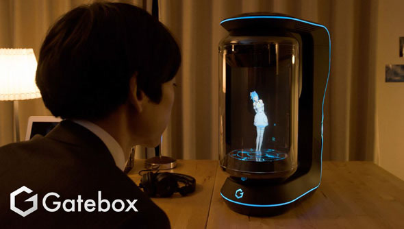 The classic Gatebox shot (user facing the device with the Azuma Hikari hologram).